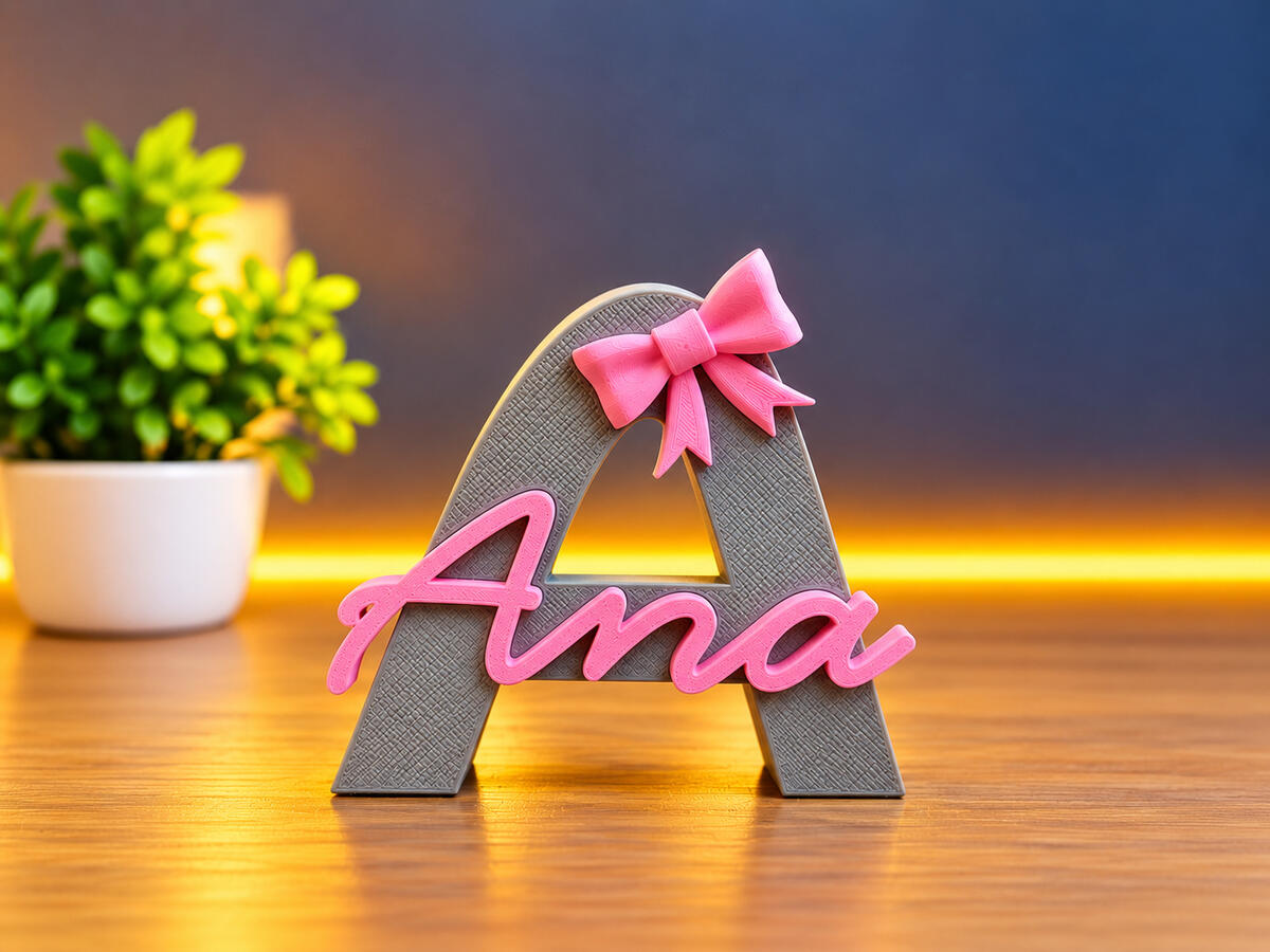 Personalized 3D Printed Name Decor Custom 3D printed letter A with the name Ana and a pink bow, created by 3DZ6.